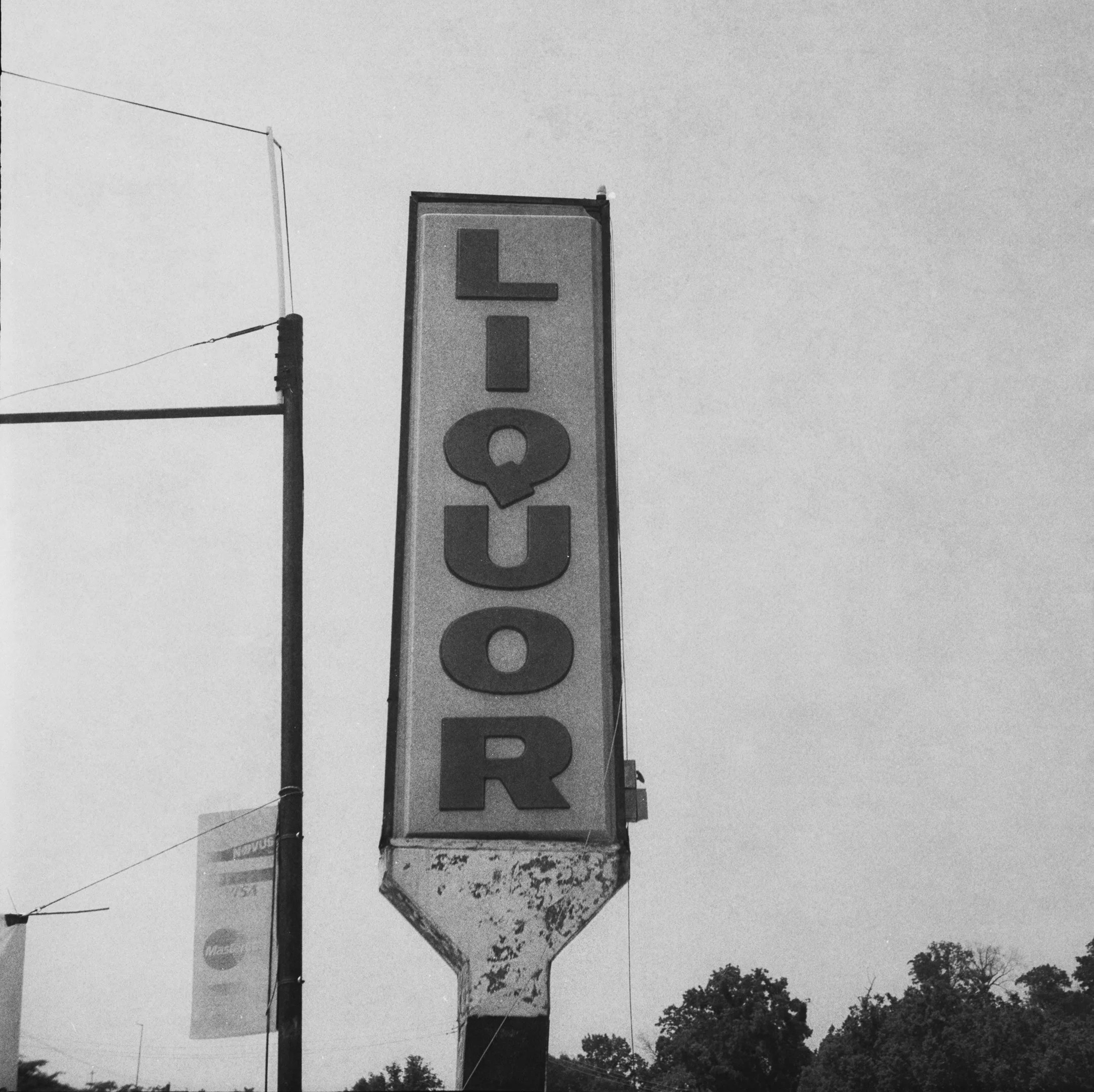 Liquor Sign outside The Electric Crocodile - Chattanooga, Tennessee 
Kodak Tri X Film Photography 
Photographer Ricky Davis of TRD Photography