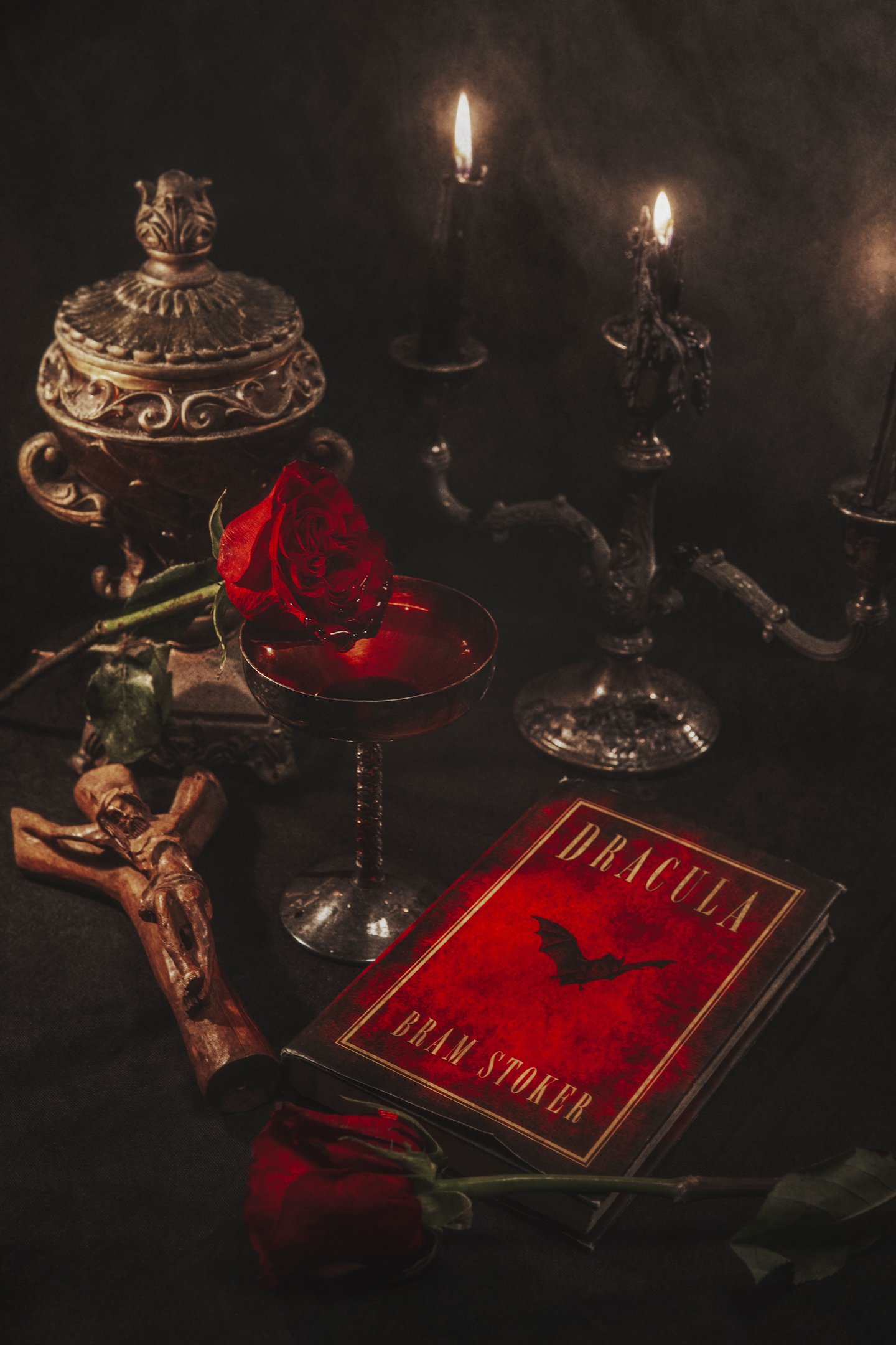 Gothic Still Life photography of a Dracula still life book with candles and a crucifix- Dark Academia Still Life Photography - Dark Academia Photography - Photo by photographer Ricky Davis of TRD Photography in Chattanooga, TN