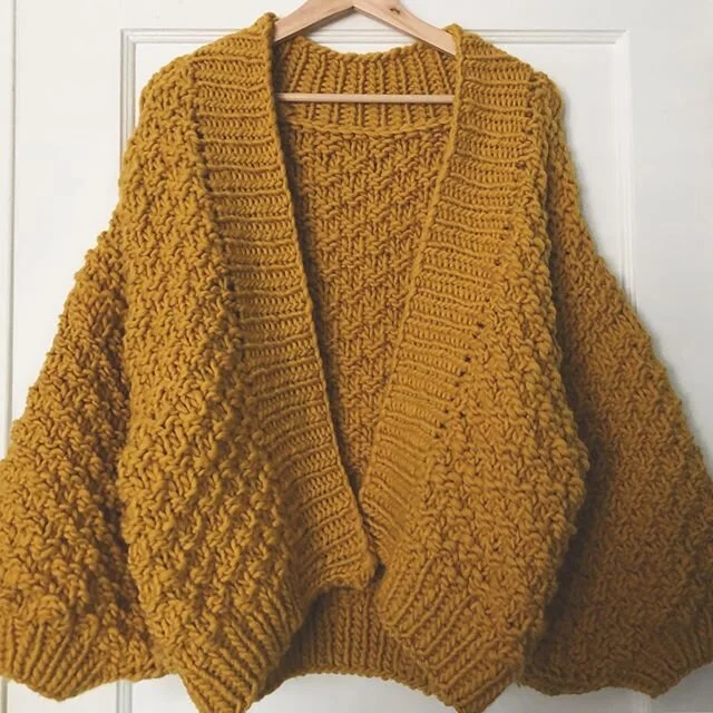 Need to properly block but loving how this cardi turned out. So happy my extra yarn came in the mail yesterday so I could finish this cutie! 
This door is the only white backdrop that gets natural light 🌞 
No pattern followed but it is based on a ma