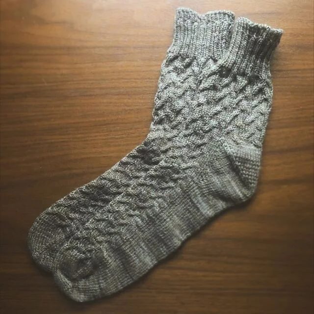 First pattern done out of the 52 weeks of socks book. 
Pattern is Intersections by @heybrownberry 
Yarn is Three Irish Girls Adorn Lux in colorway Minnesota Ave

One thing I found helpful with this pattern was sizing up the needles once you start the