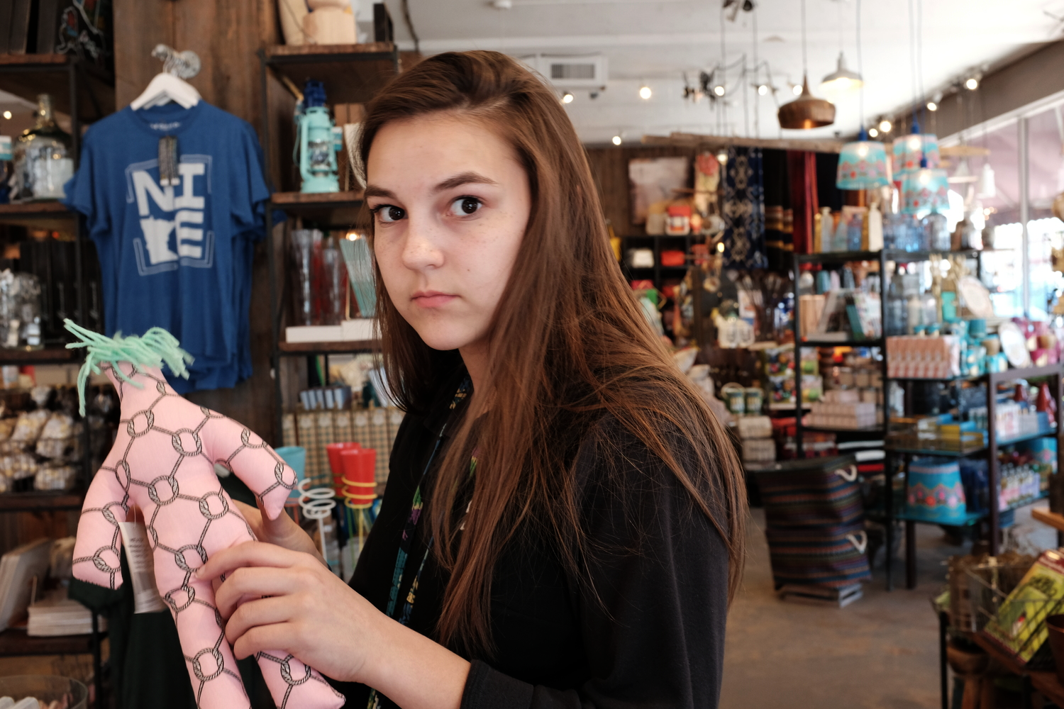 Some surprise street photography on my daughter at a local gift shop. I can normally make her smile!