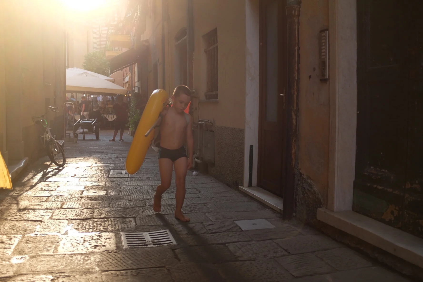 Kid running with innertube