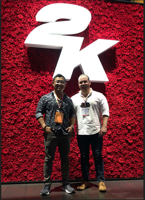 James and Davis representing CAH in front of 2K’s impressive wall of roses