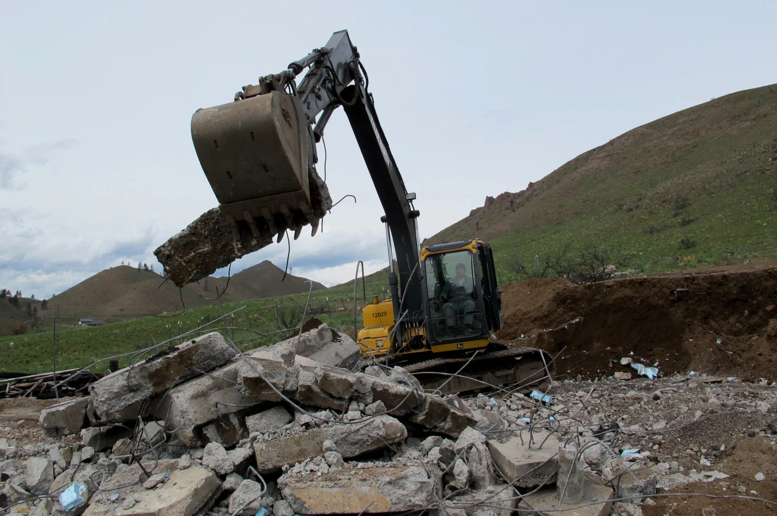 Tyson Jensen clears foundation on Balky Hill Road.jpg