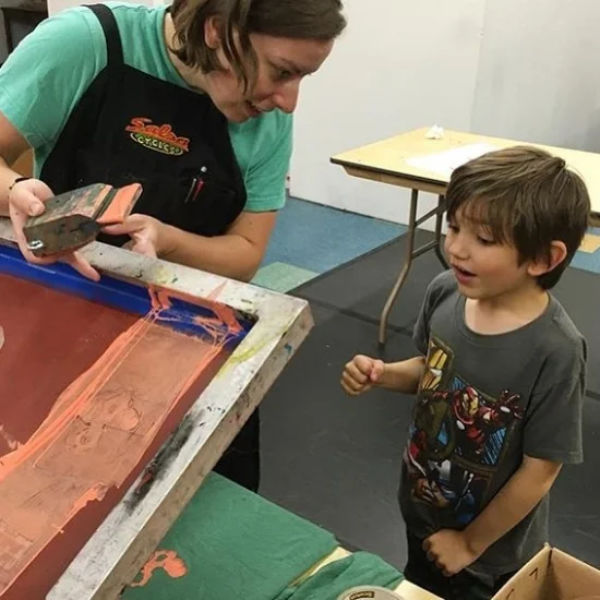 Gallery team and IC Press Co-op member, Chrissy Cooper, screenprinting an alterego with Leo during ICPC Superhero Gear camp (June 2016)