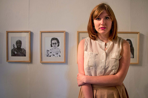Taylor in front of her exhibition Guarded at PS1 in 2015
