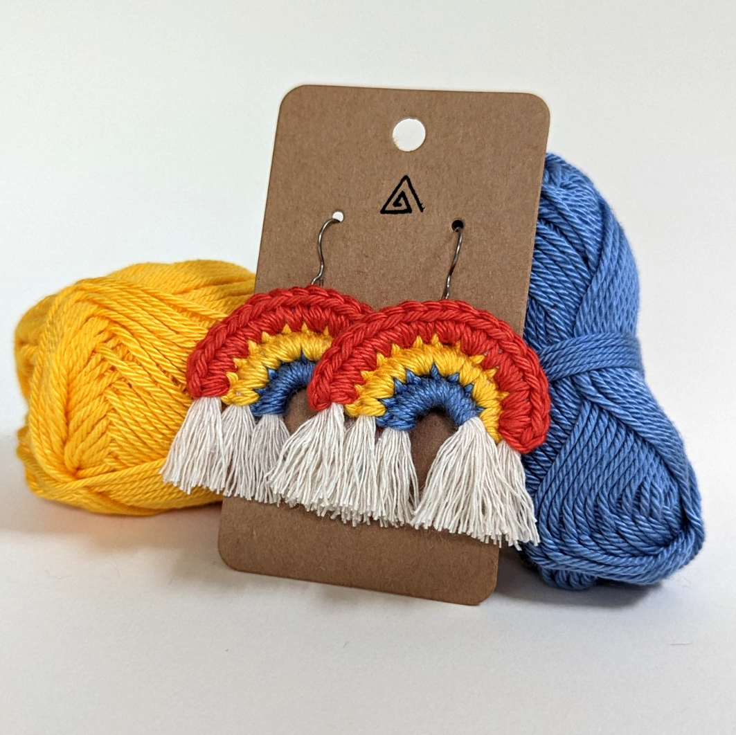 Crochet rainbow earrings, created and donated by Anna Reishus