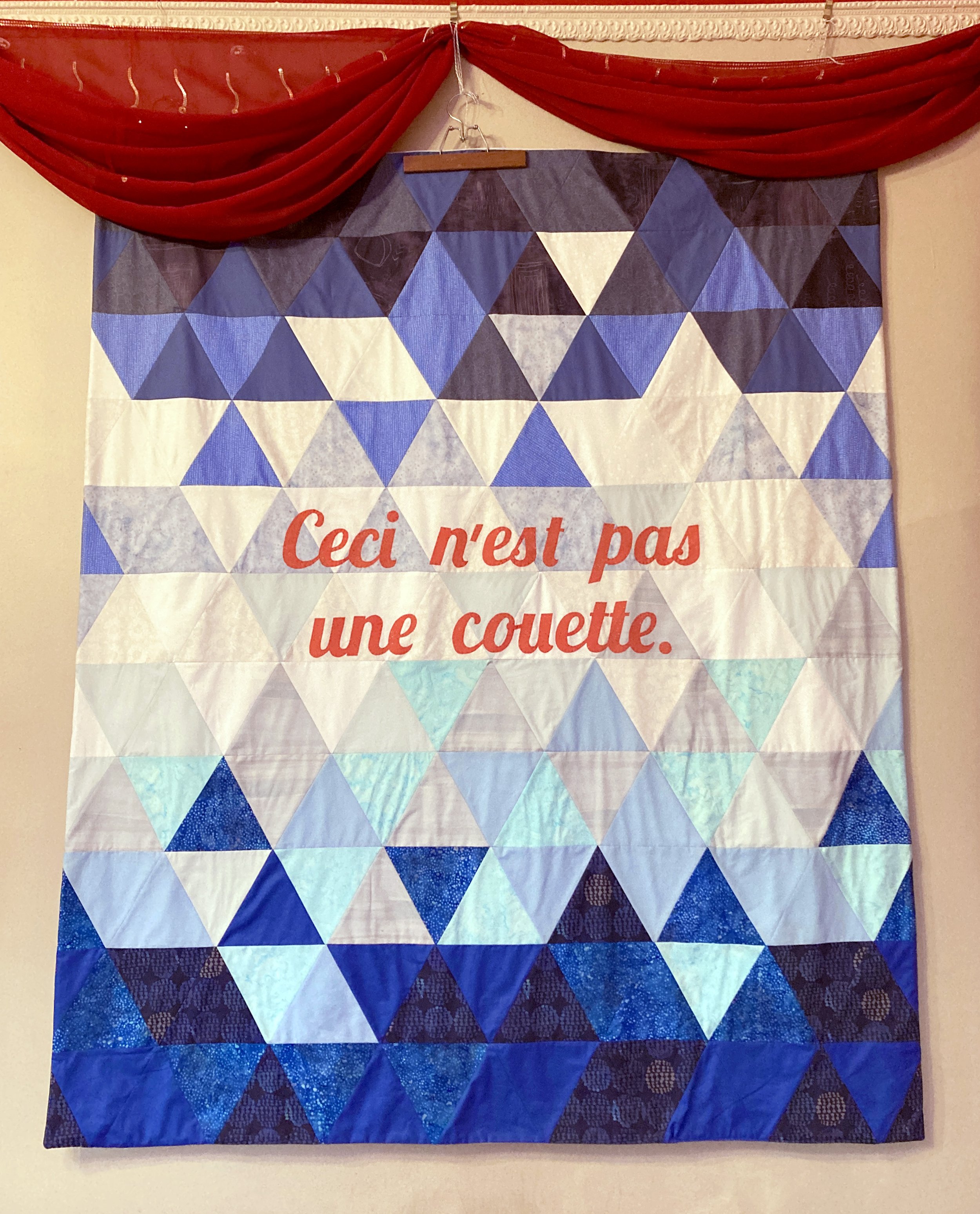 “Ceci n’est pas une couette” quilt (56”x68”), created and donated by Sharon Moore