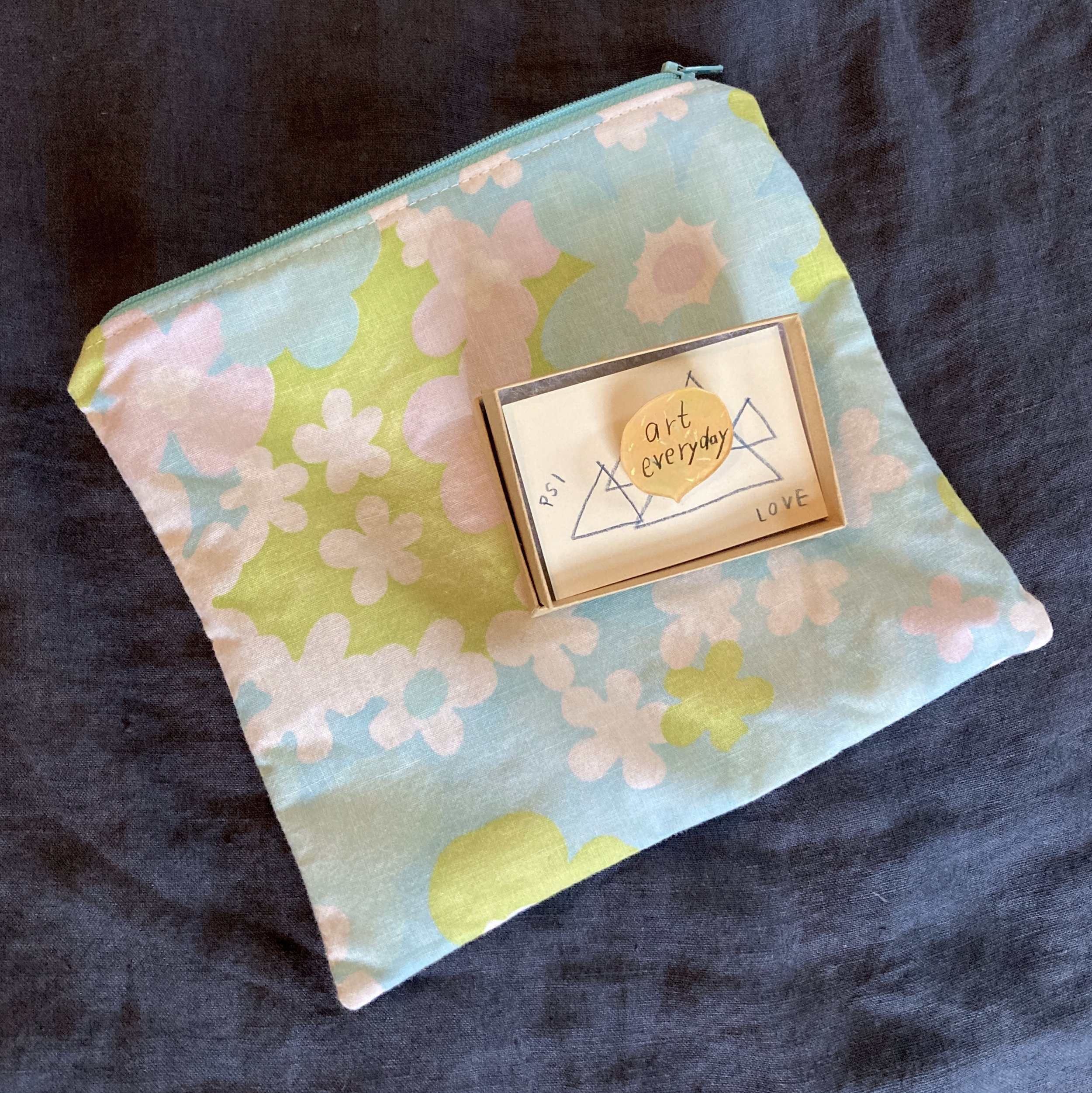 zipper bag (Ellen Schneider) and “art everyday” pin (Sayuri Sasaki Hemann)
