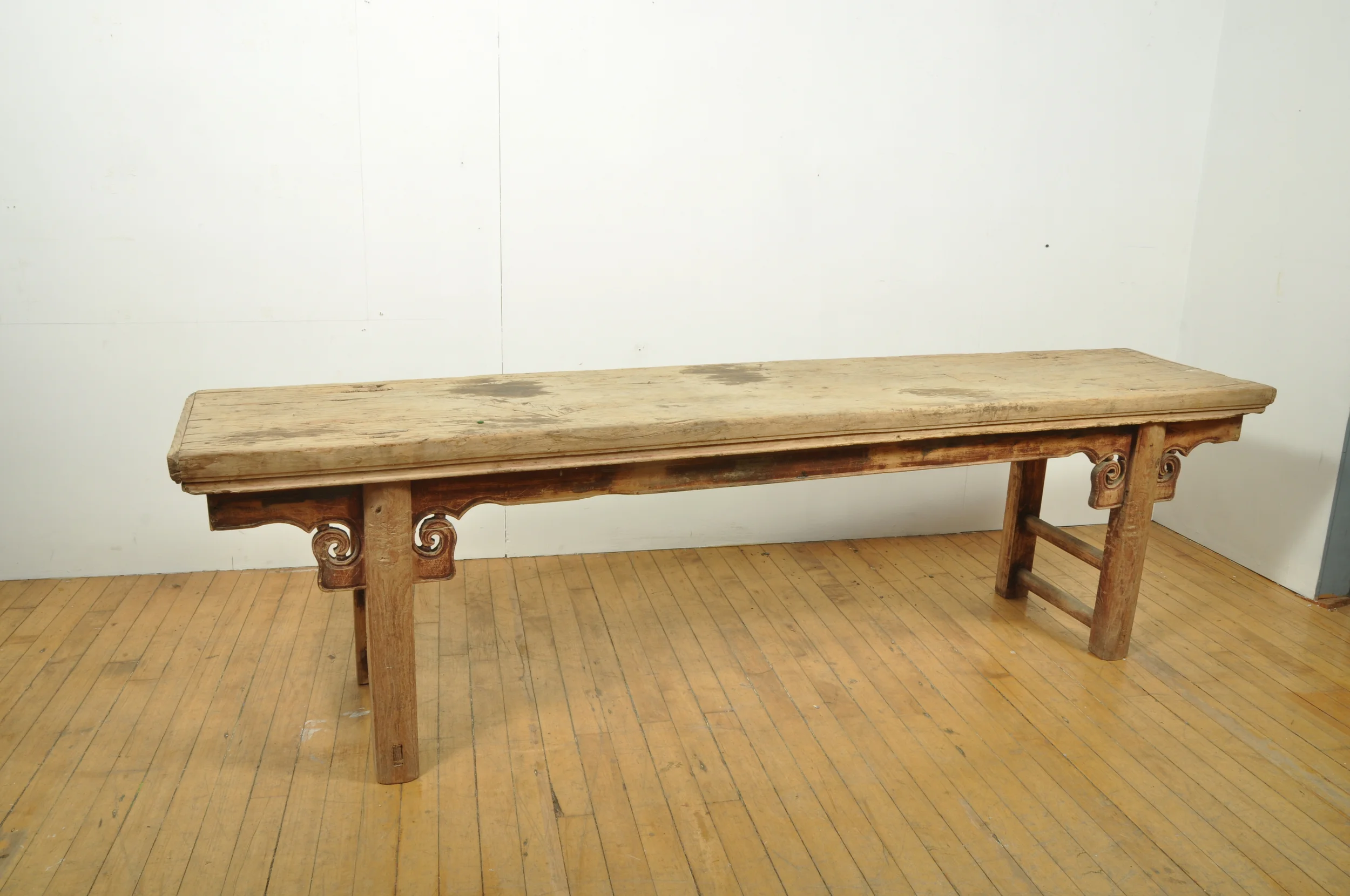Rustic Chinese antique bench with scroll apron detail