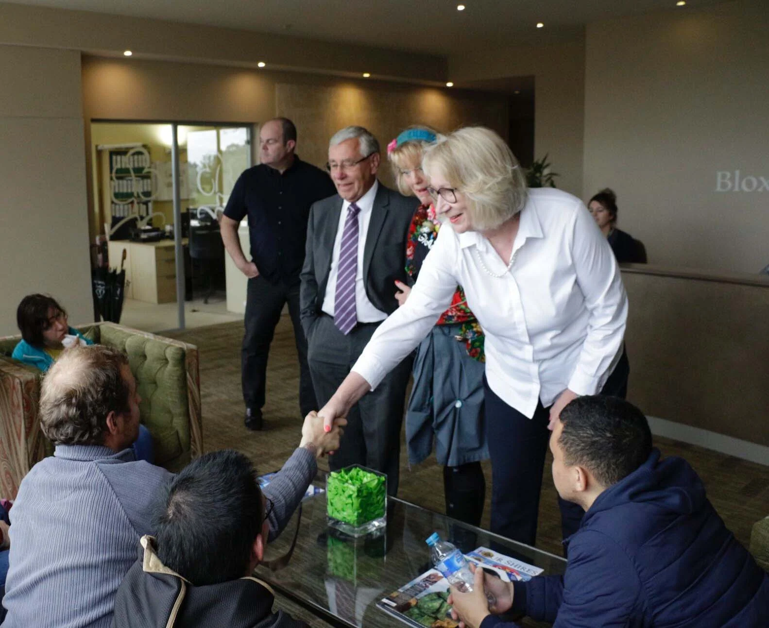 Bloxham Mill's Jan Burnett shakes hands with the participants