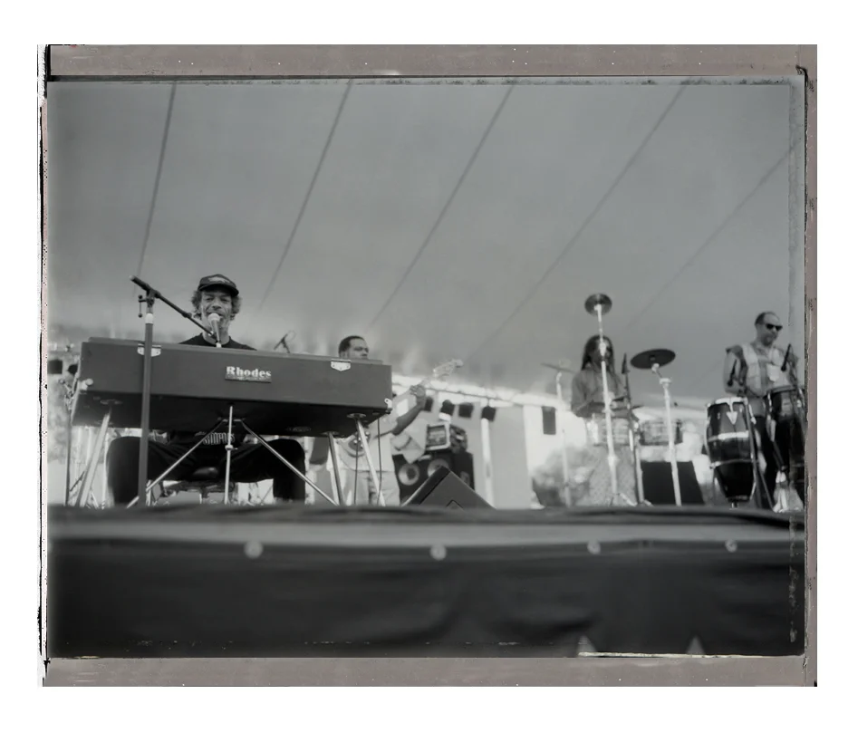During his performance at WOMAD I was throwing my polaroid prints onstage as a gift to him. He acknowledeged it with a smile.