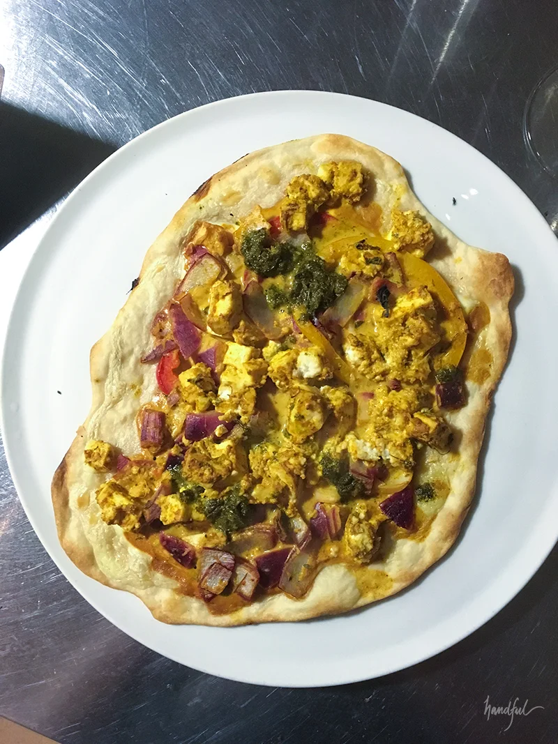 The Spicy Paneer Tikka Flammkuchen, straight out of the oven, pending coriander garnish