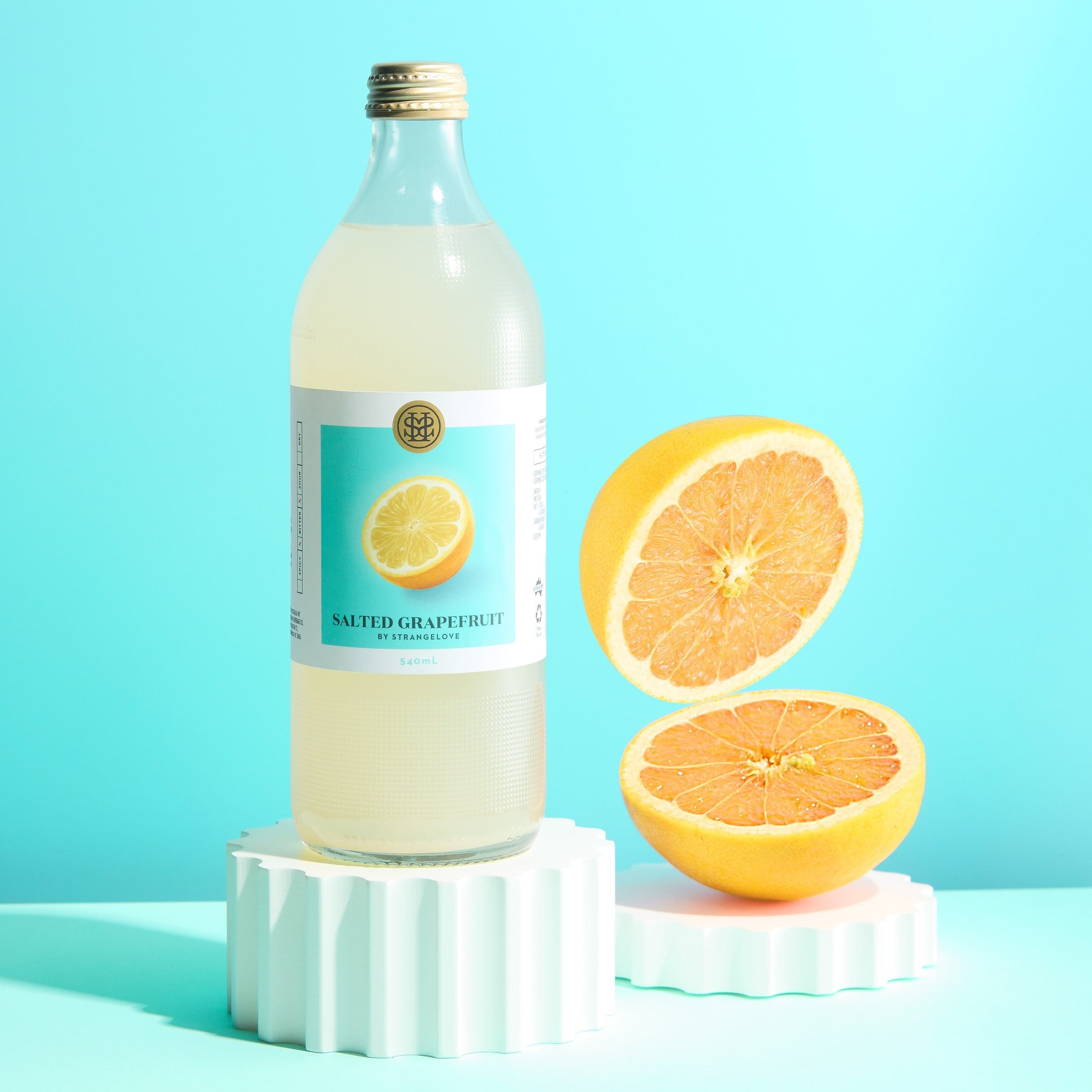 Controlling the background color tone is crucial in product photography, especially to align with the brand packaging color. This often requires numerous subtle adjustments in Photoshop. While the bottle remains static, ensuring harmony with the vivi