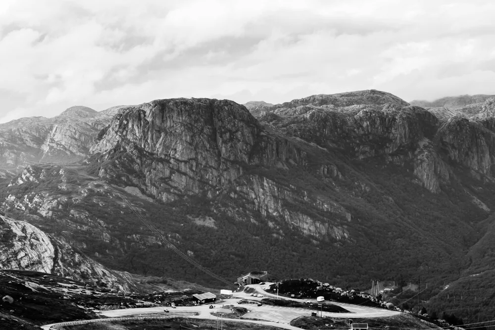 The tourist centre at the base of Kjerag faces granite outcrops across the fjord