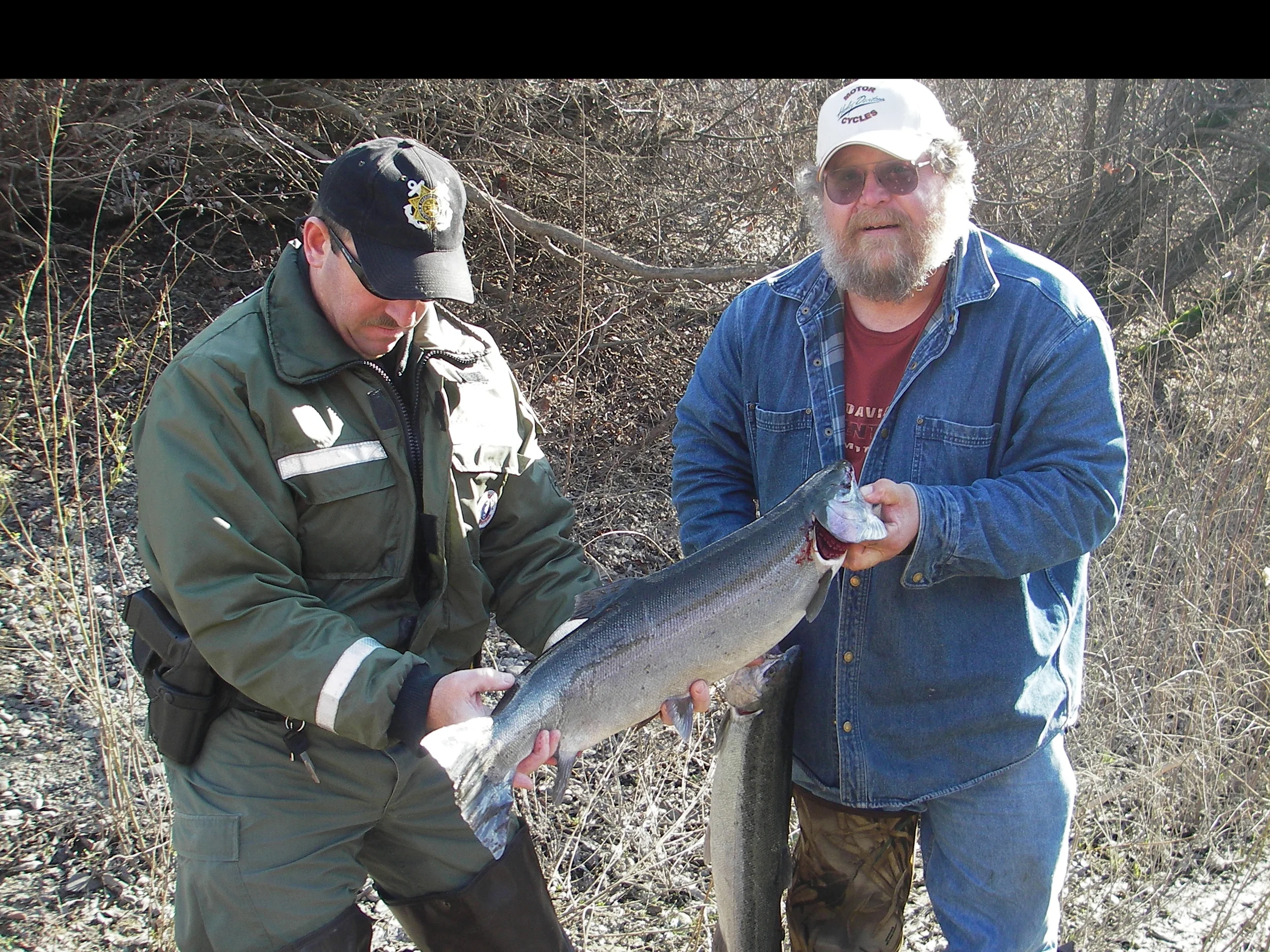 Marine Unit Deputy admires a citizen's catch at the Russian River.