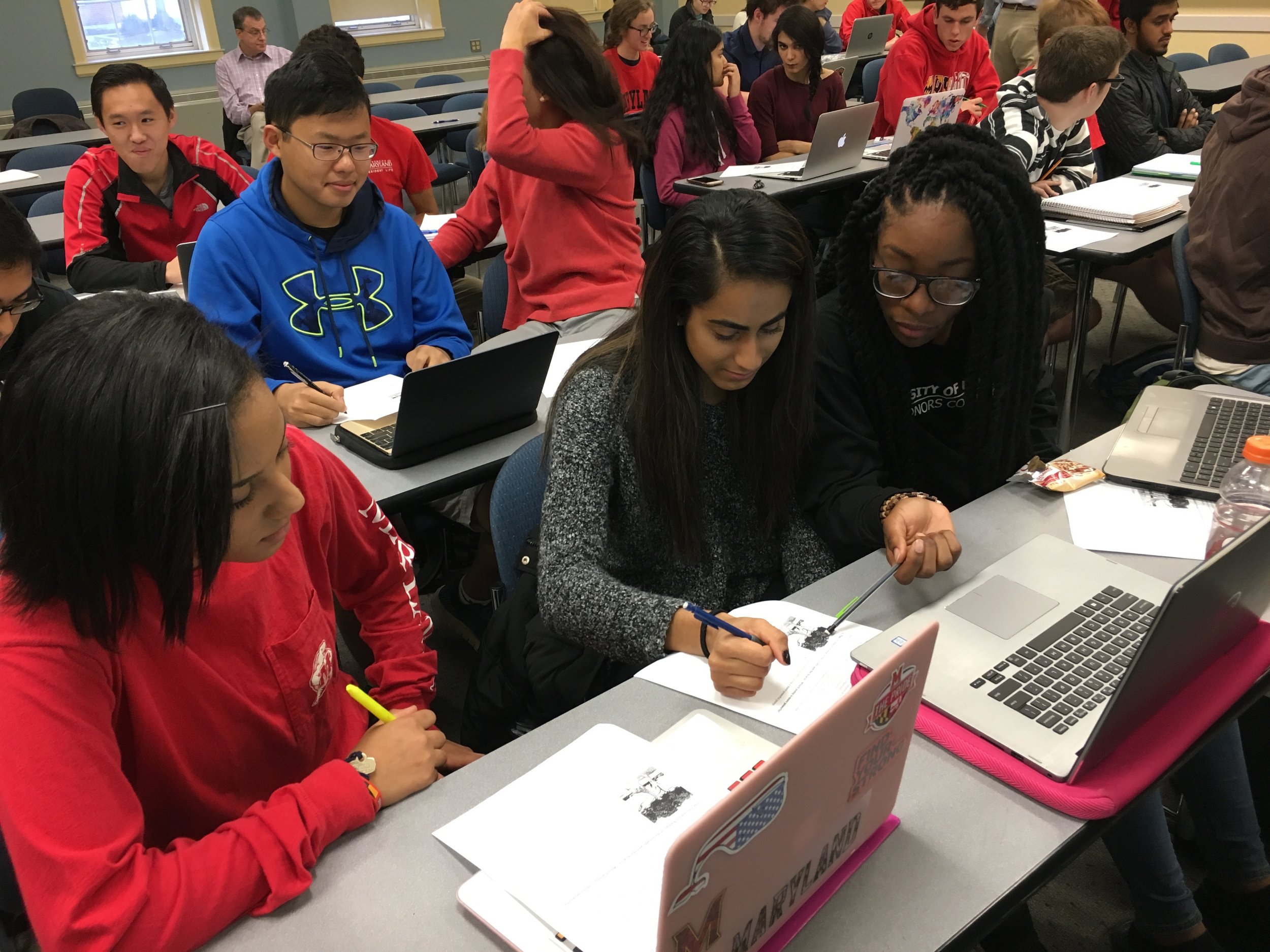 ILS students working together on a problem set in class.