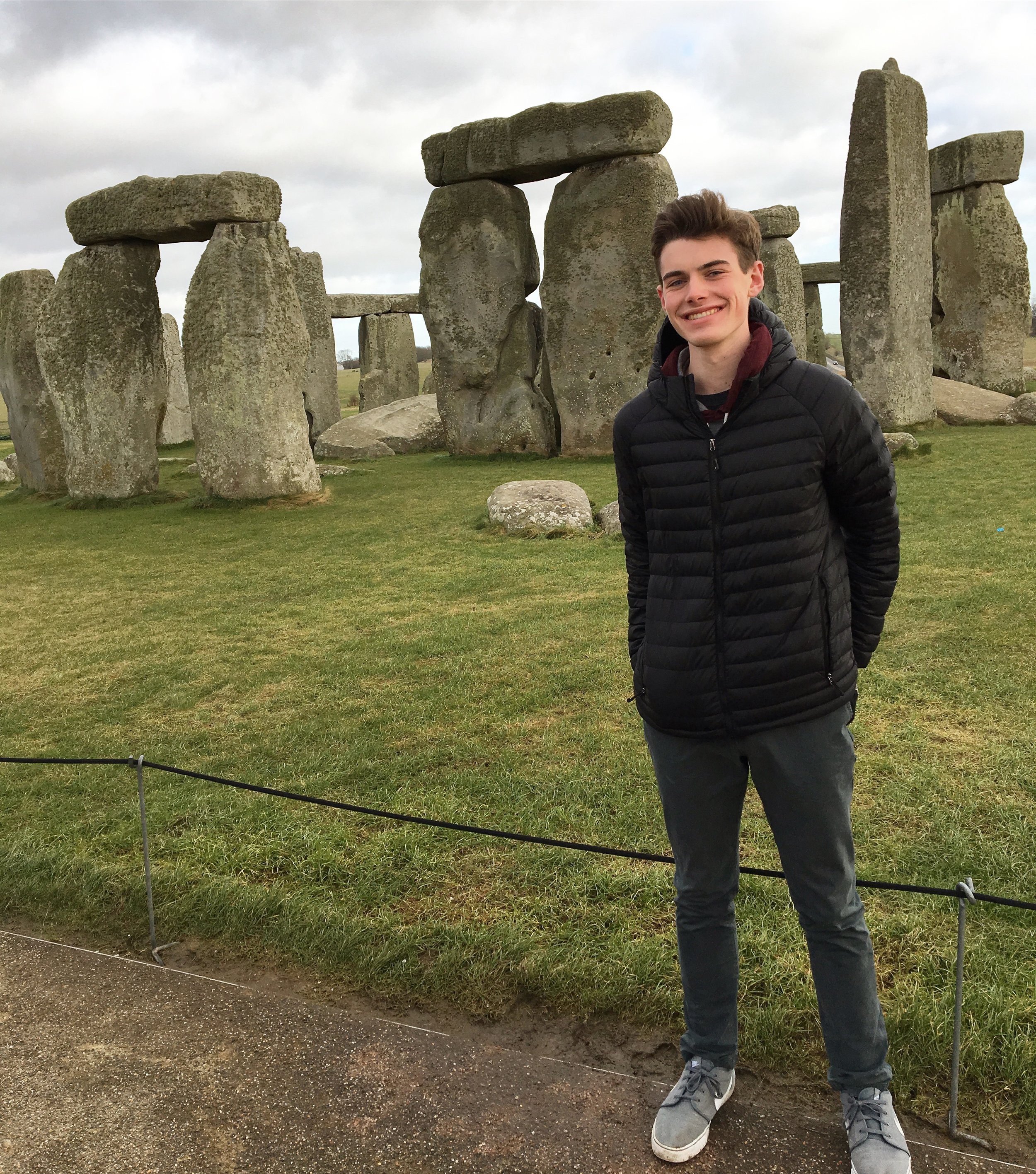 Brian Florenzo standing in front of Stonehenge on British Masters of Science Study Abroad Course.