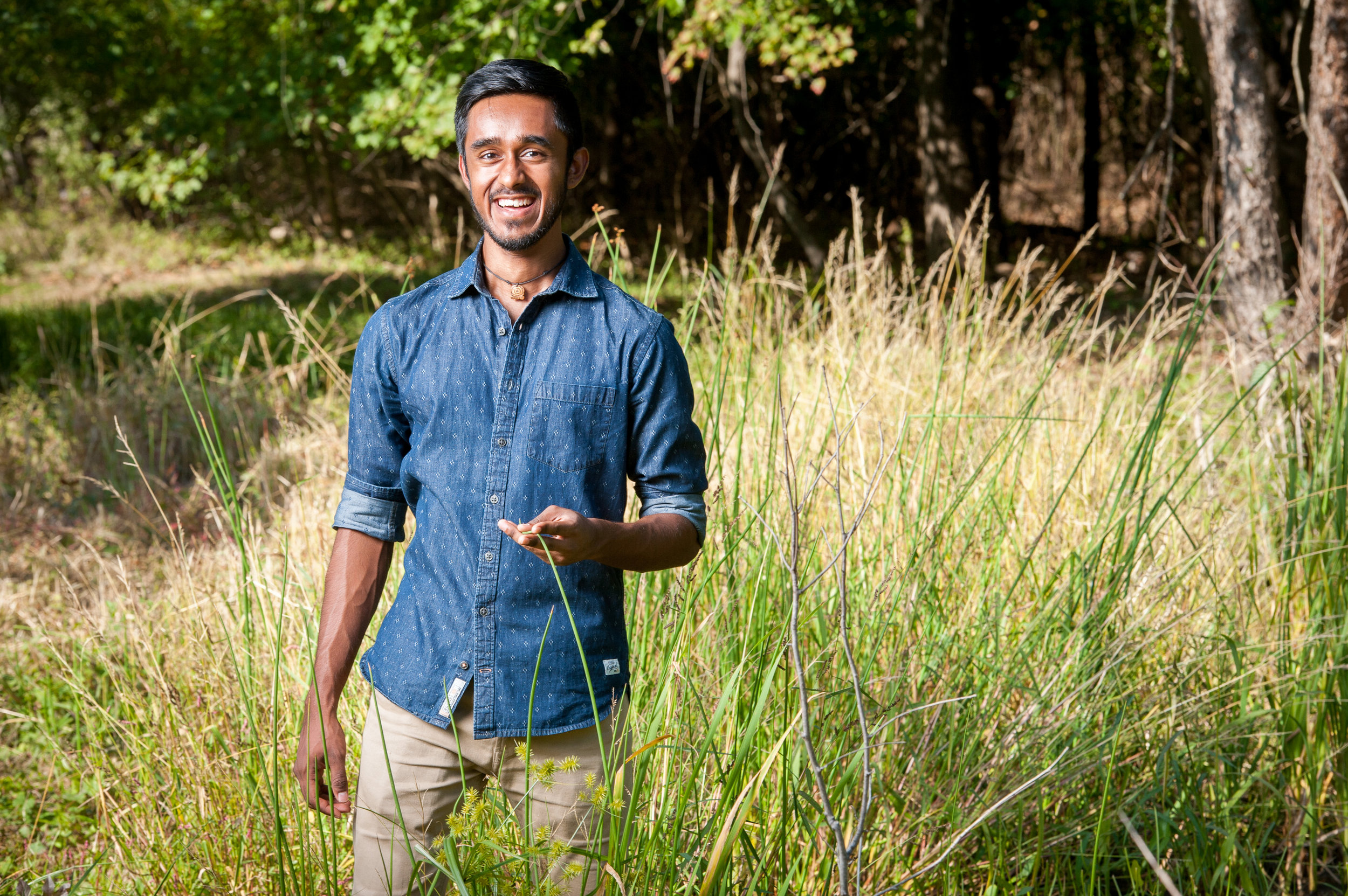 Picture of Donald Dealwis in a field of tall grass.