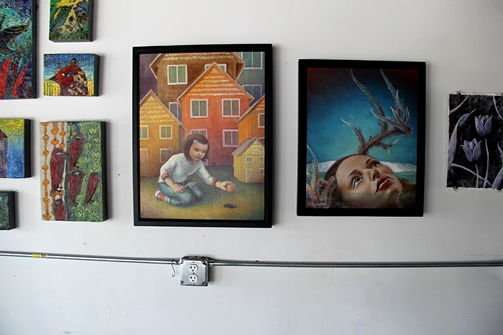 Jenn Hale's oil paintings flanked by Anna and Sherry's. 
