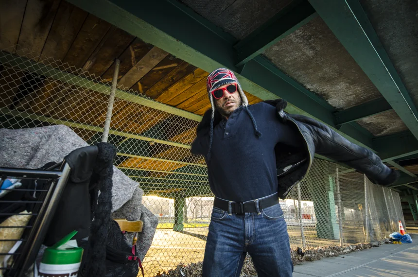 José puts on his jacket before heading back to the recycling center. He's very attentive to his style.