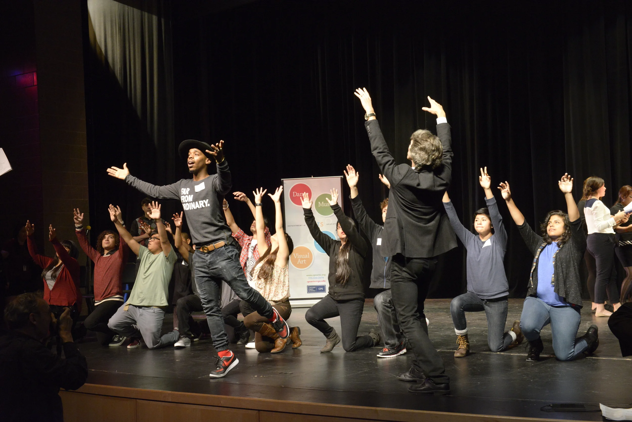 Drama students of Benito Juarez Community Academy are joined onstage by Damian Woetzel and Lil Buck