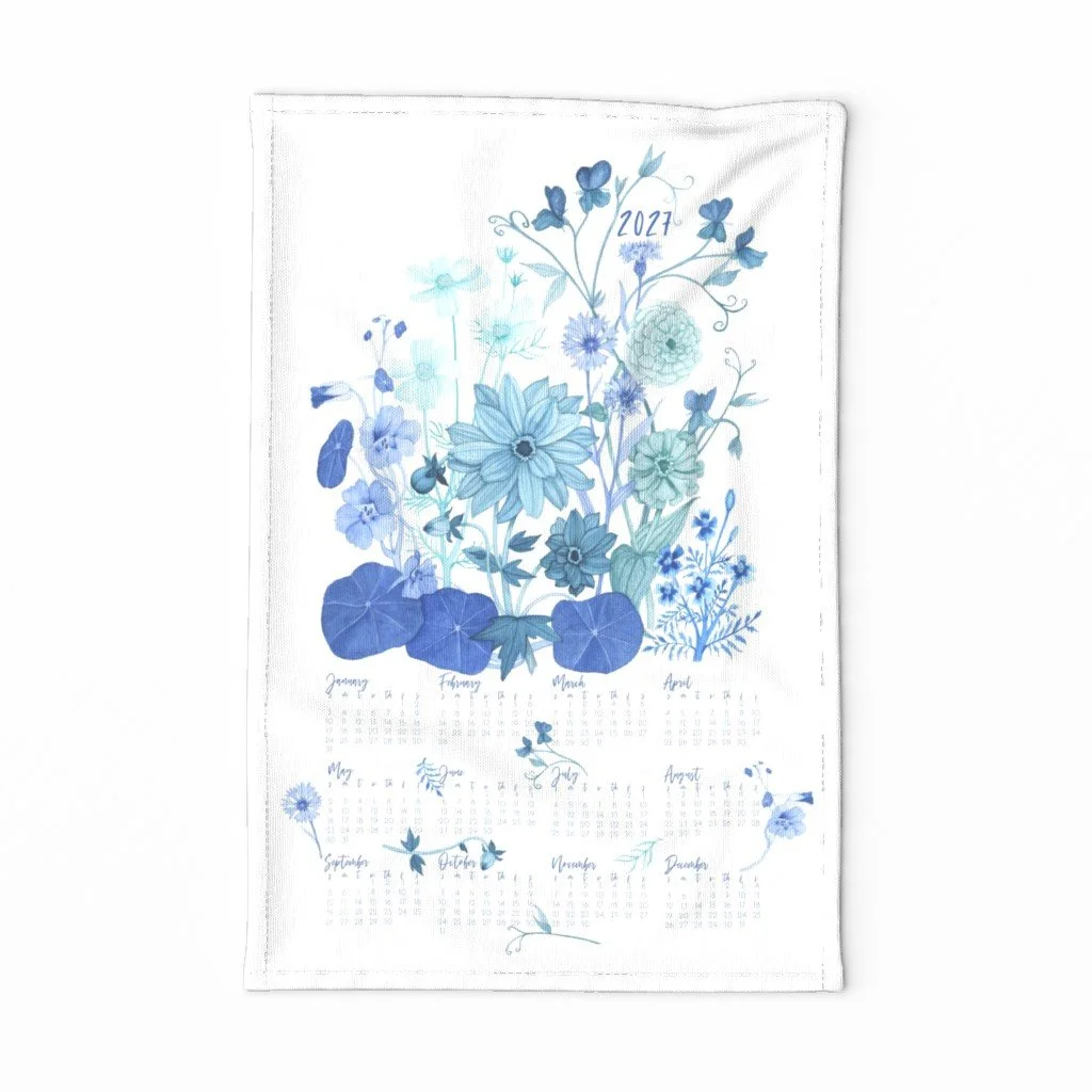 A Beautifully Illustrated Tea Towel Calendar for 2027 with garden flowers painted in blue by watercolor artist Anne Butera