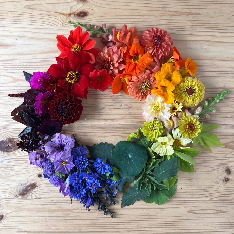 a color wheel created with flowers and leaves