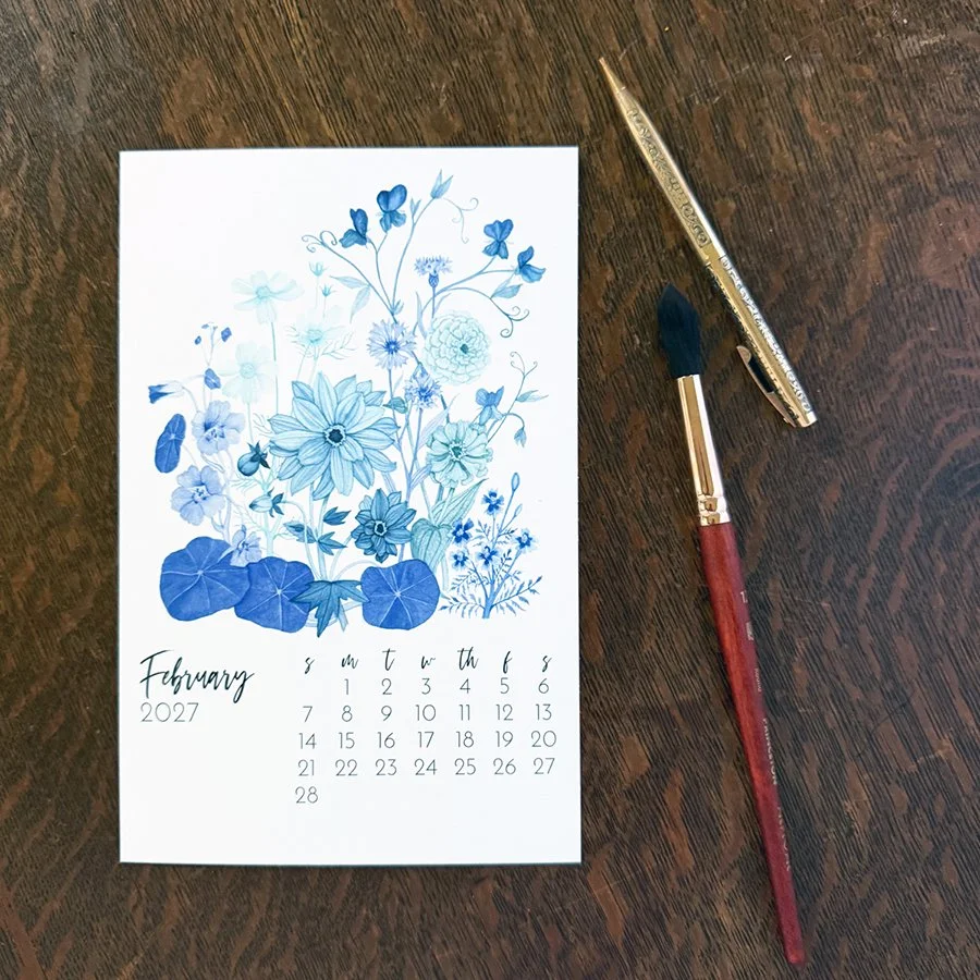 The February page of Anne Butera's 2027 Desk Calendar features her painting A Gardener's Winter Dreams