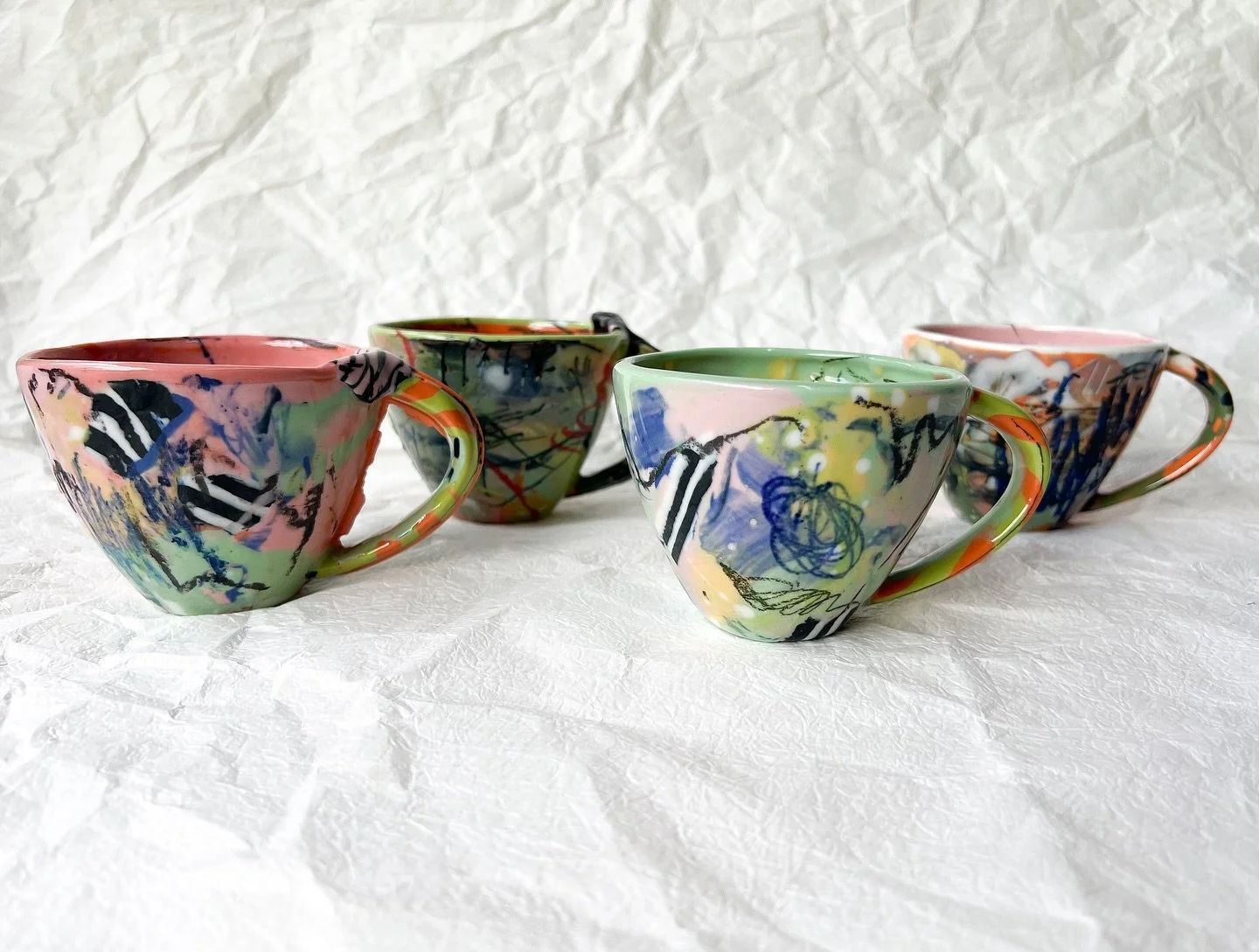 ‘Cups for Grandpa’, a collaboration between Pete’s granddaughter Lindsay Smith and his daughter Ruby Pilven.
Slip cast porcelain cups, homemade crayons, underglaze pencils, glaze. 
As part of the MANY cups/mugs/vessels/artworks fo