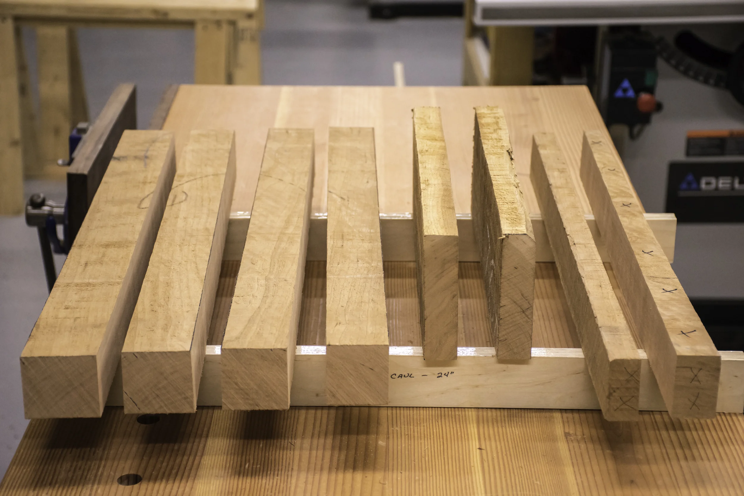 Rough blanks for four legs, two upper stretchers, and two lower stretchers.