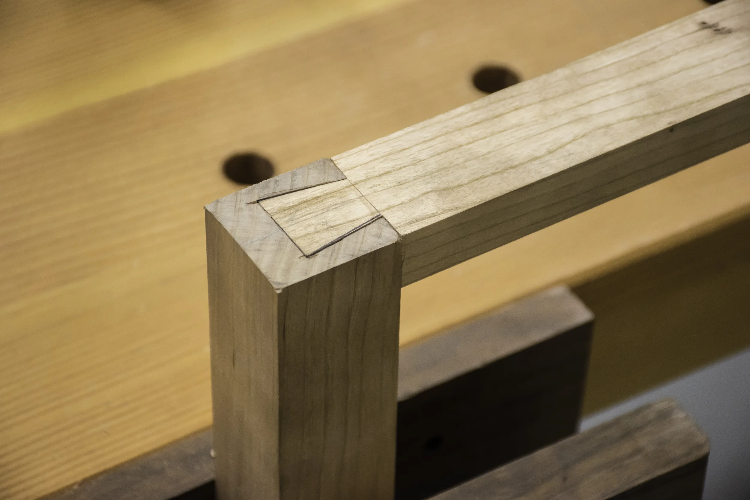 The dovetail is a strong mechanical joint to attach the upper stretchers to the legs.