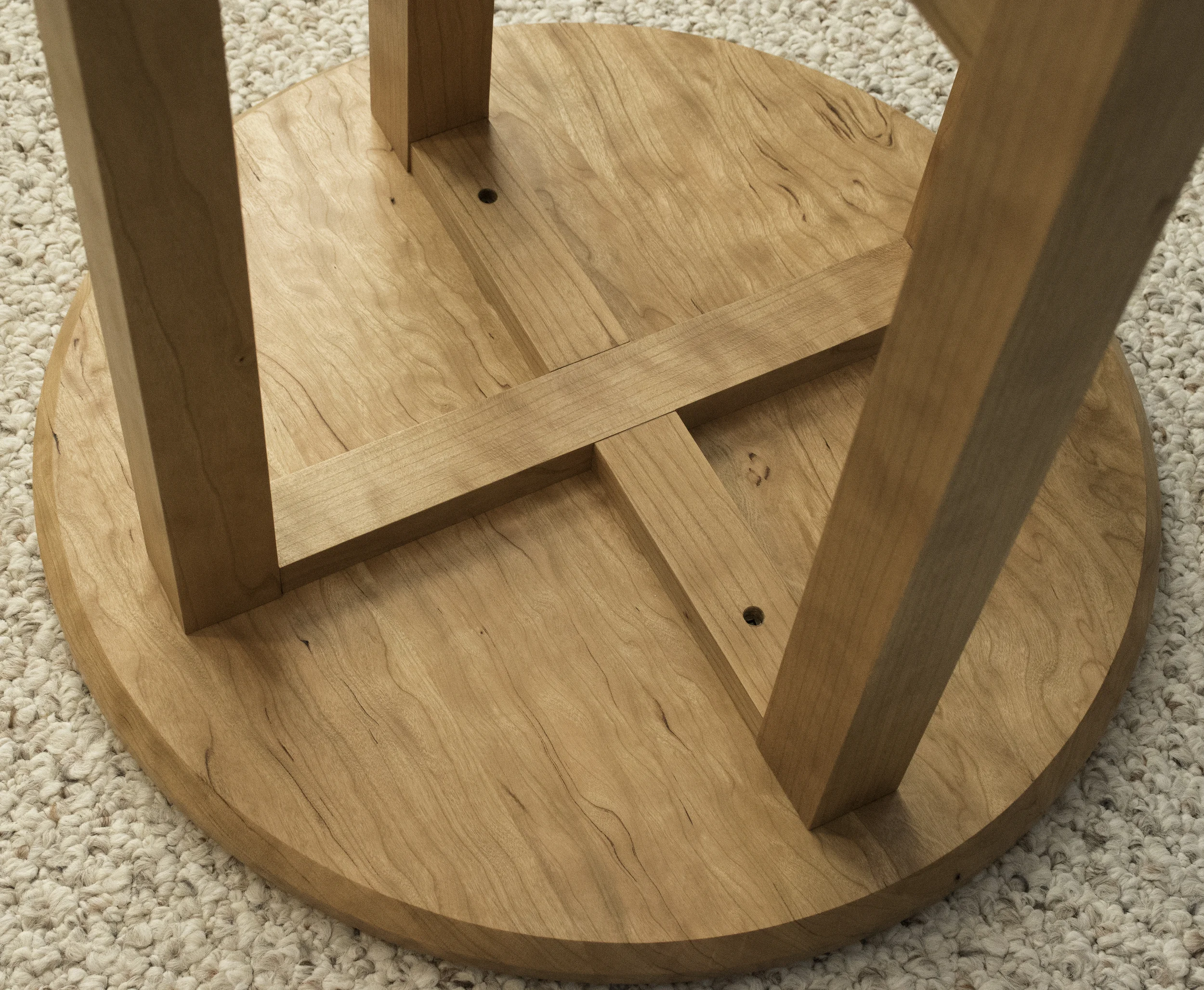 Two screws aligned with the grain are enough to hold the top in place.