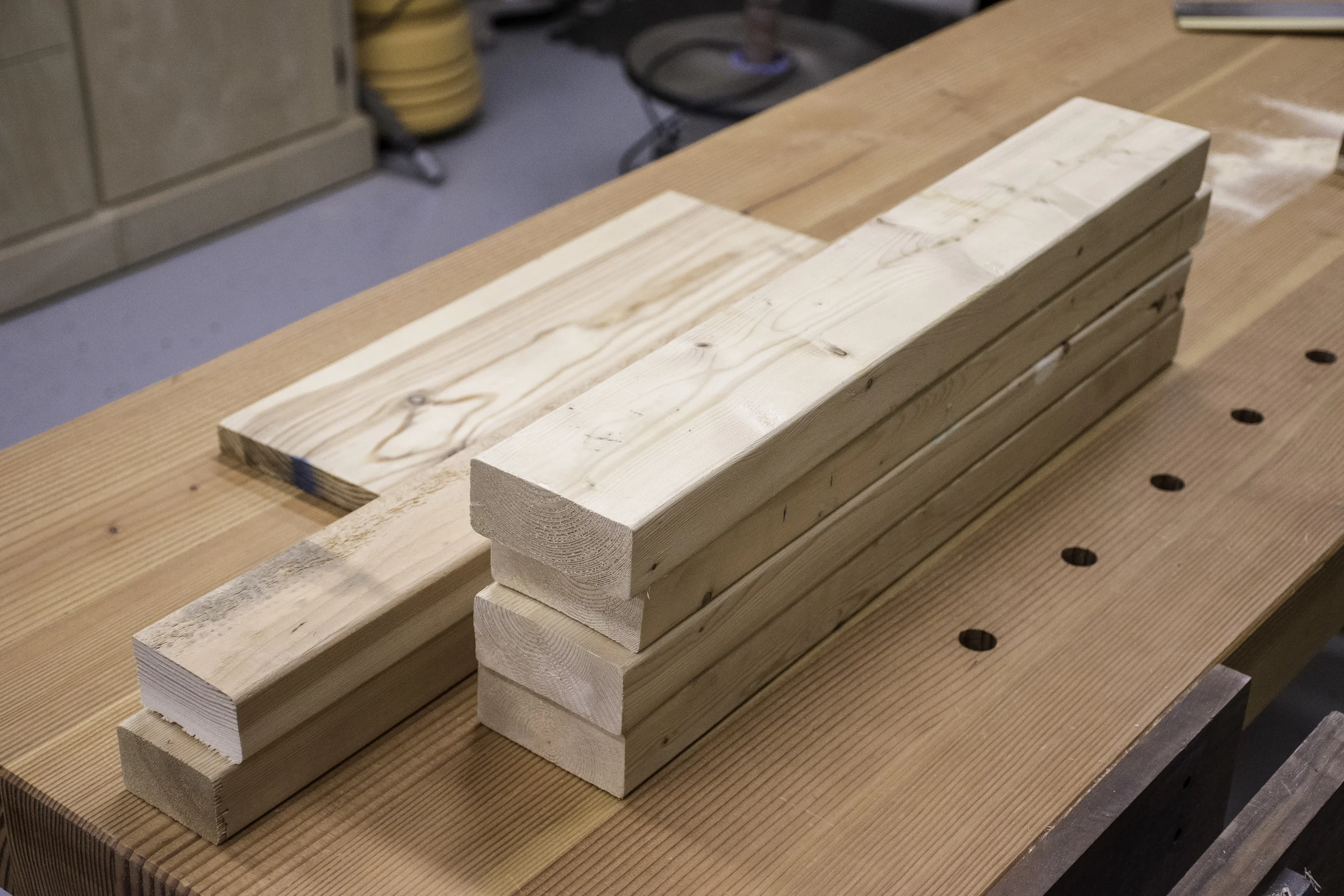 These gnarly paint-splattered 2x4 and 2x3 scraps will become the base of my sawbench.