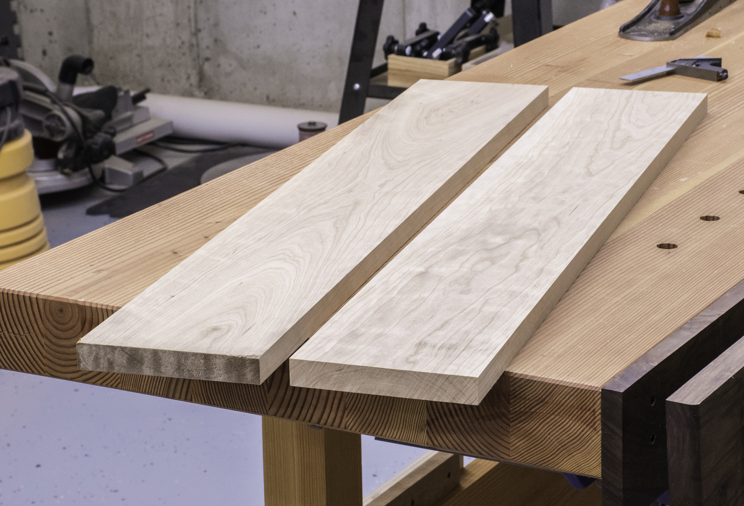Two boards of sappy cherry serve as the top of the sawbench.