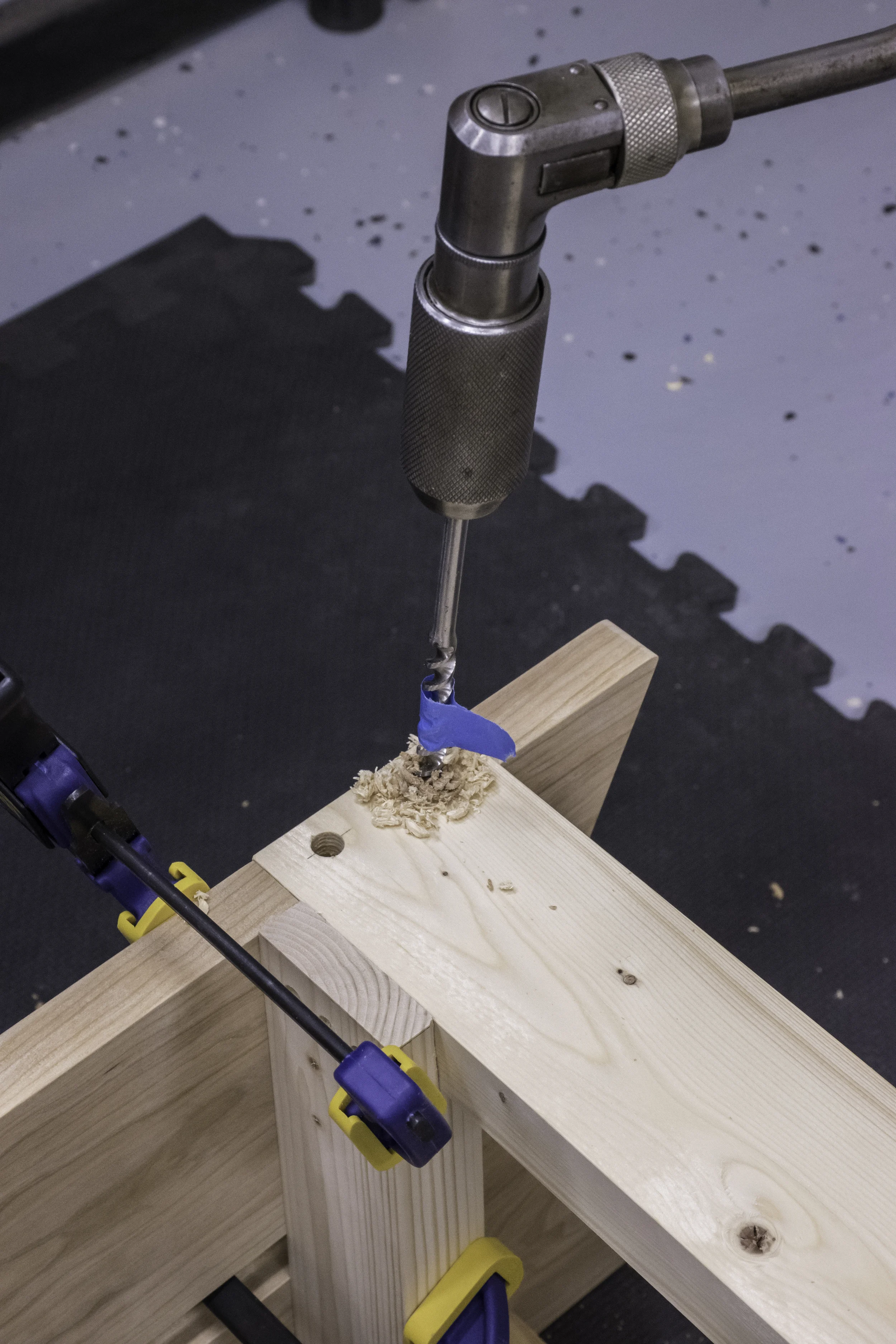 Boring the holes for the dowels.