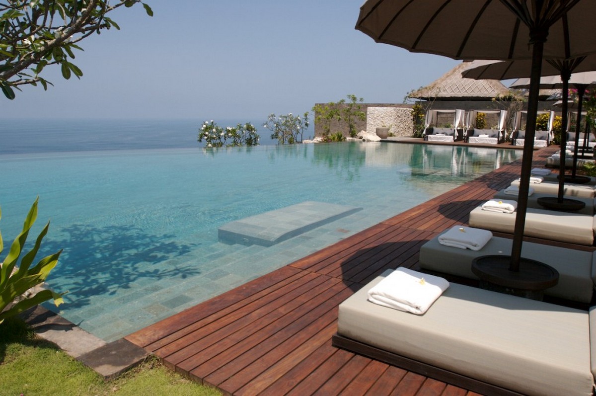 relaxing-with-beautiful-infinity-pool-and-timber-deck-also-comfy-lounge-chairs-of-Bulgari-Resort-and-Spa-in-Bali.jpg