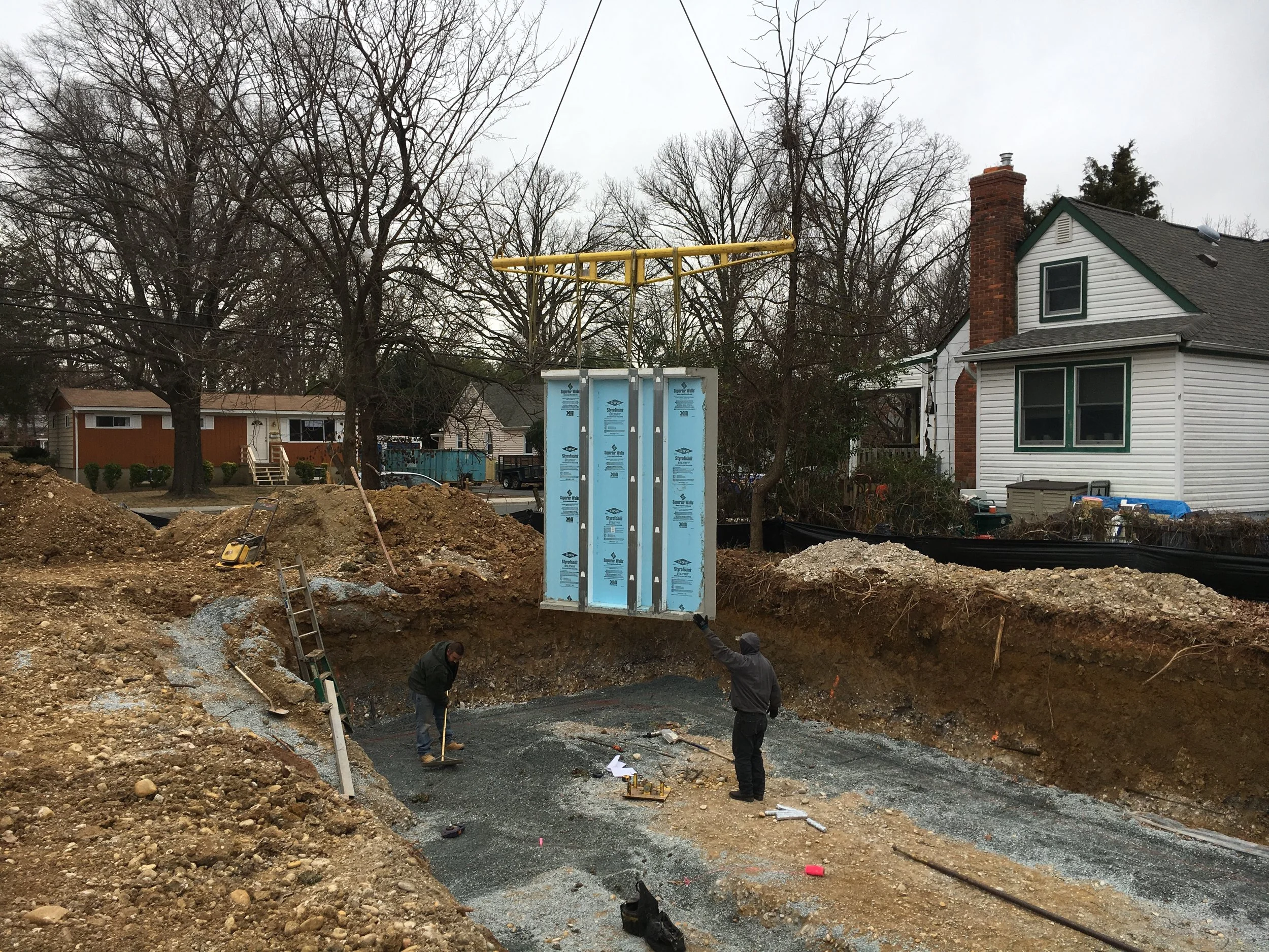 I was lucky the John took a photo of the first wall being installed a little before 9:00 am. Before the began installation they used a compactor to get the walls exactly aligned. So aligned that they are not more than an 1/8" off. Amazing!