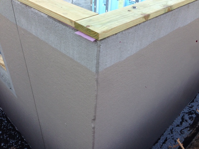 First layer of waterproofing is applied. The area with no waterproofing will contain stone on top of it.