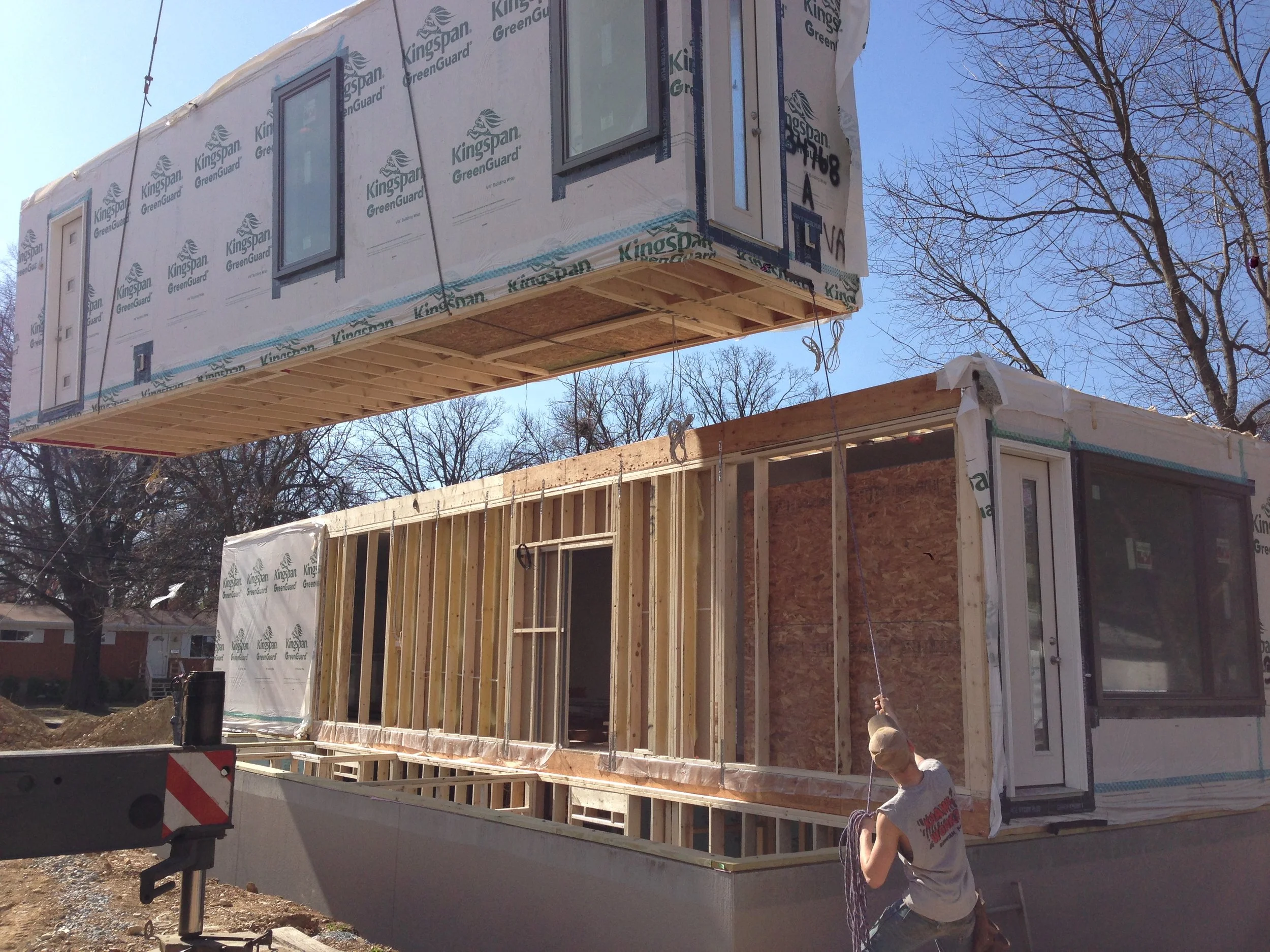 10:00 - The second unit being installed. The crane does the heavy lifting but the guys guide it into place.