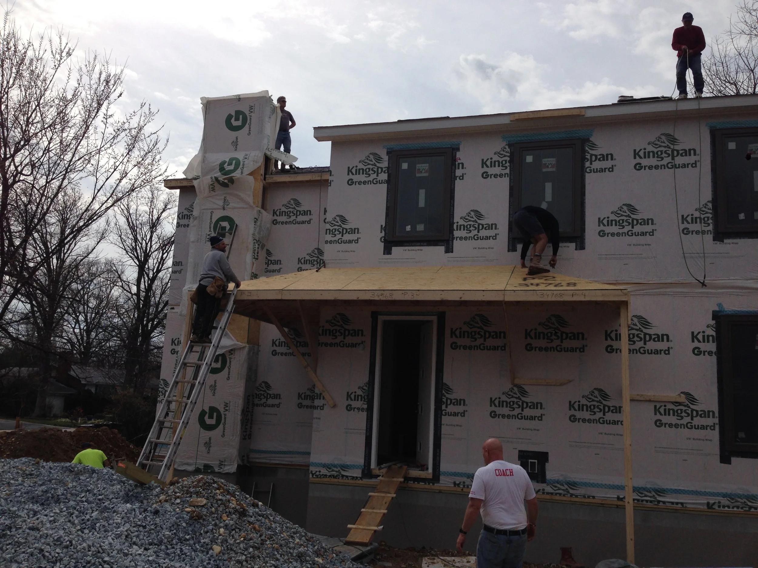 The chimney installed and the roof porch ready to be shingled. 