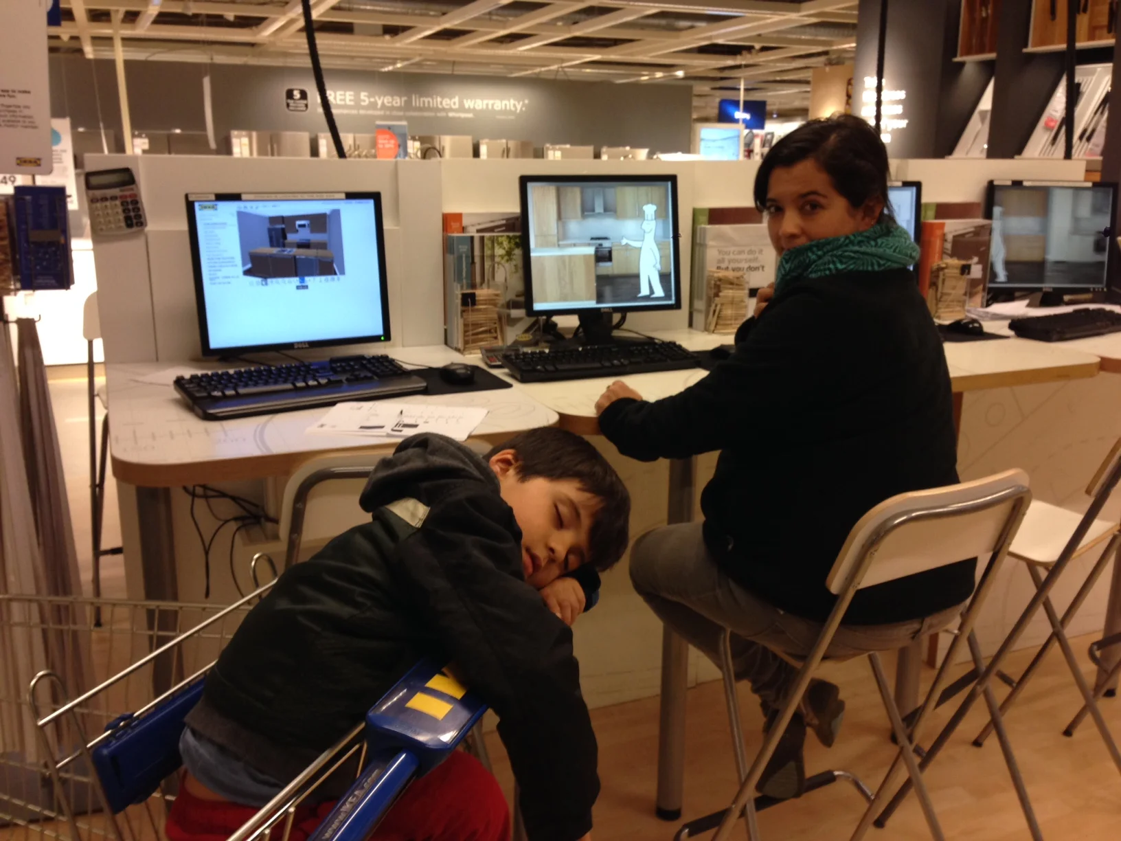 Finalizing our kitchen cabinet order at IKEA. Pedro has had enough of these shenanigans and Daniela isn't far behind. there is a lot to buy!