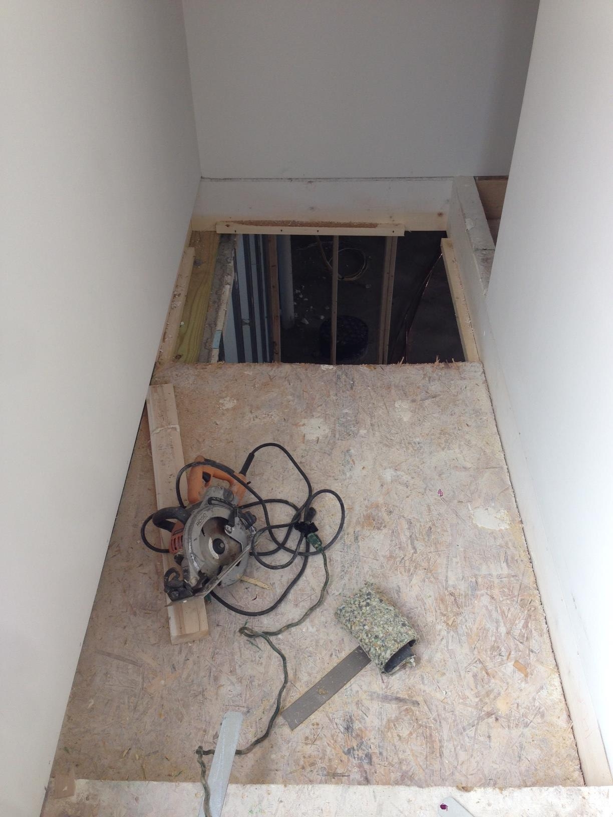 The hole being opened to build the staircase into the basement. There is a lot of work to do on the inside that requires removing temporary walls/floors and patching up other places due to the stress of the transportation and lifting into place. Within a week all these items will be completed. 