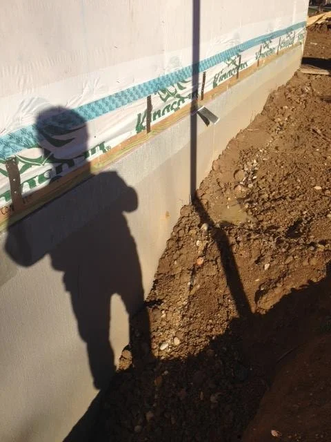 The corner of the house backfilled with the dirt on site. This is what I need to make the city approve. Not that other detail that some lame architect drew (me back in August of 2016). 