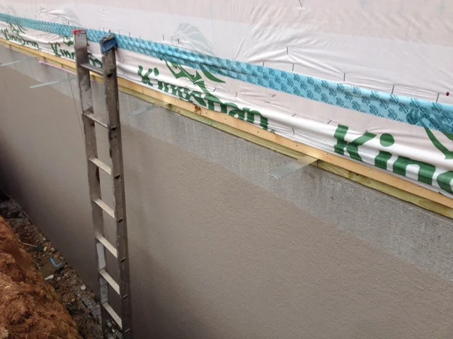 The straps being placed is what holds the Superior Wall to the Modular framing to act as one system. When we backfill there will be no concern of the Superior Walls tipping over. These are placed about every 3'.