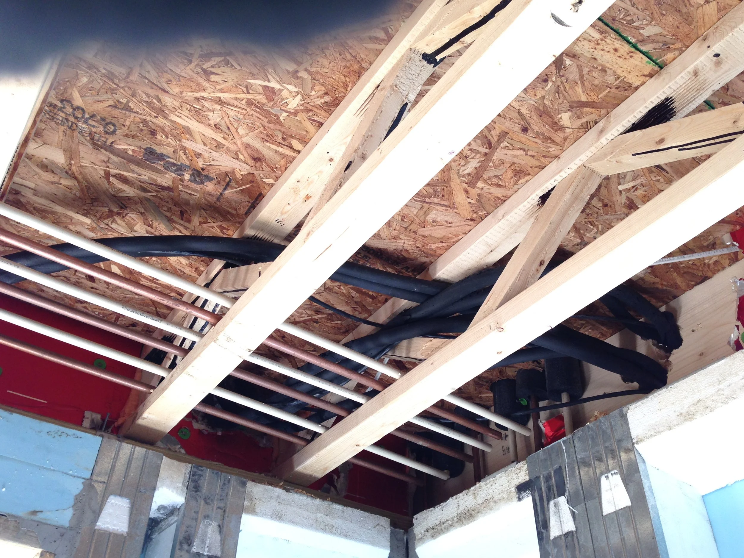 Those same 6 lines coming down from the basement and then drilled to the exterior. The black line are the correct materials. The copper that is also shown is incorrect. I will remove those and use them for the basement water supply and sell the left overs to a scrap yard.