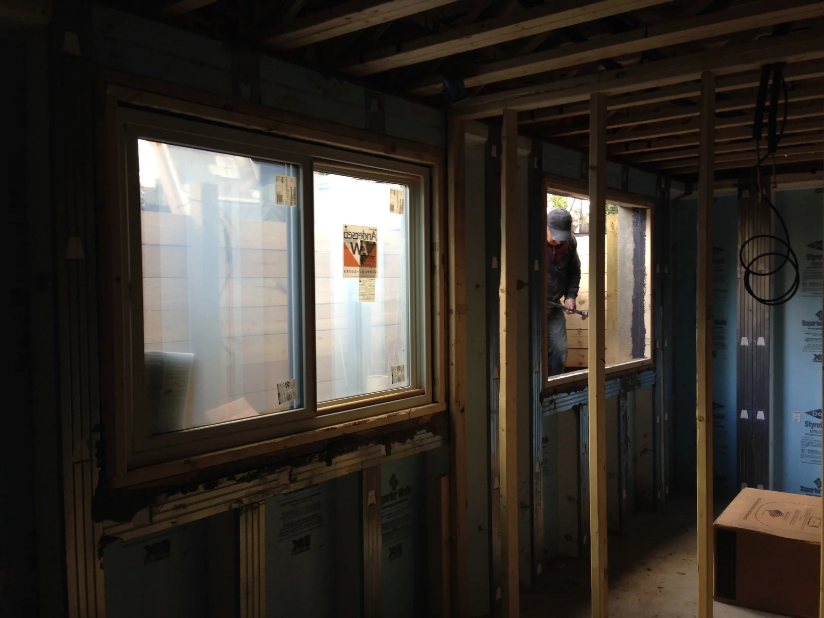 I was inside placing the shims as Miguel and Rudy lifted the window into place. Amazingly the windows were perfectly level. The Superior Walls made everything level. Once again, systems make life easier!