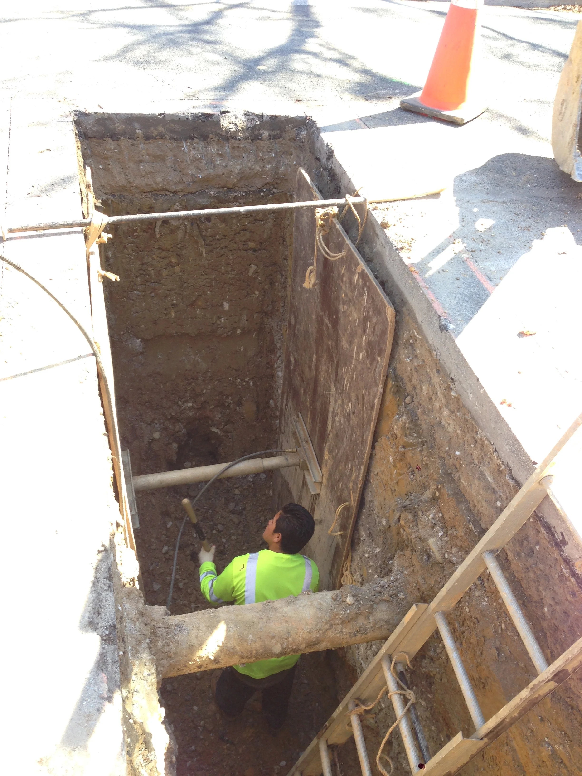 Temporary walls being installed in the trench. It's deep!