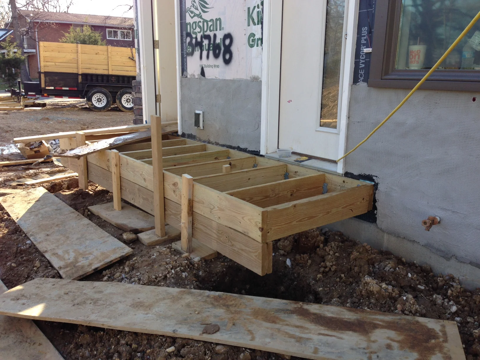 Deck framed with temporary post. They did this because the footings have to be approved first before they can attached the post. They don't want to just sit there waiting so they work around the inspection. I'm starting to trust these guys.