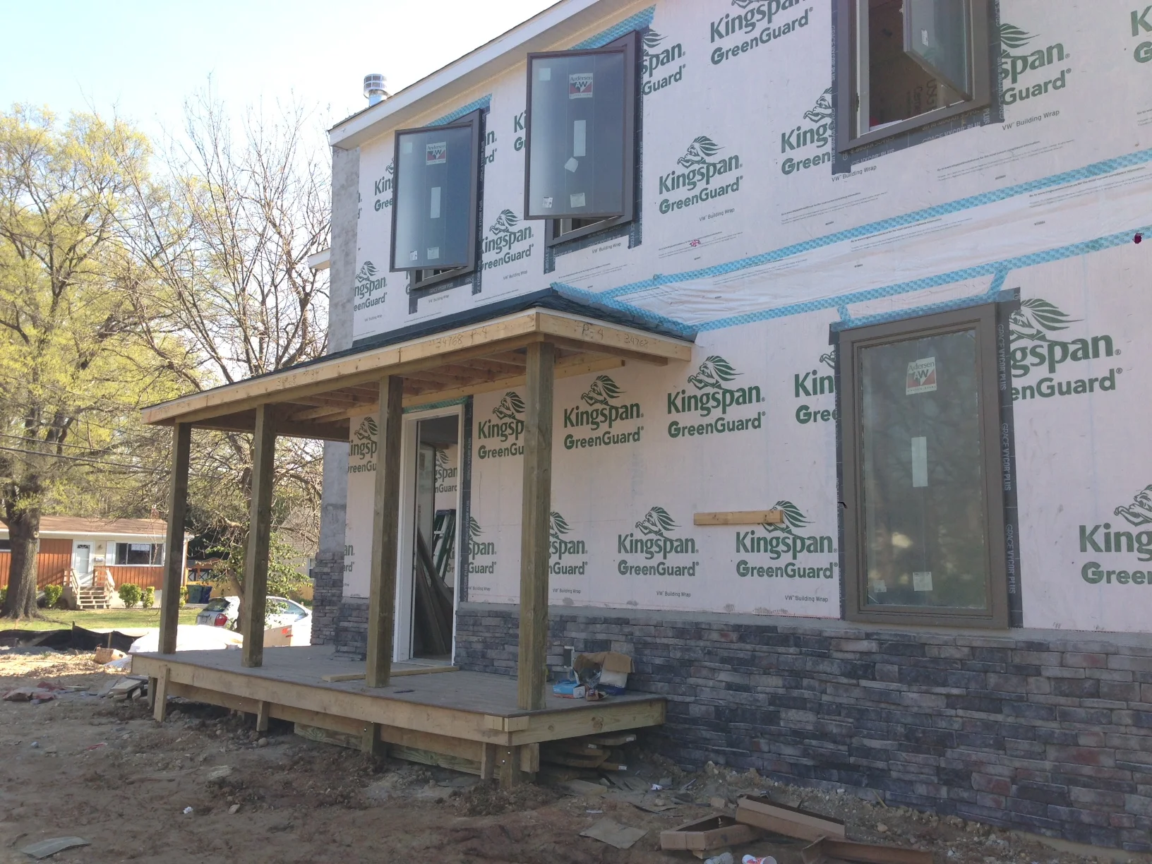 The porch now has post to hold up the roof. Progress!
